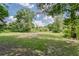 Large lawn area featuring trees at 2708 De Montmollin Rd, Plant City, FL 33565