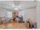 Bedroom featuring wood floors and plenty of room for storage at 2708 De Montmollin Rd, Plant City, FL 33565