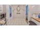 Hallway featuring stylish decor and tile flooring, connecting different areas of the home at 2708 De Montmollin Rd, Plant City, FL 33565