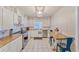 Bright kitchen features white cabinetry, butcher block countertops, and stainless steel appliances at 2708 De Montmollin Rd, Plant City, FL 33565