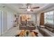 Spacious living room with tile floors, comfortable seating, and a view into the kitchen, offering a welcoming and functional layout at 2708 De Montmollin Rd, Plant City, FL 33565