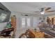 Cozy living room featuring tile floors, comfortable seating, decorative accents, and access to a serene outdoor view at 2708 De Montmollin Rd, Plant City, FL 33565