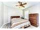 Inviting bedroom features a warm color palette, cozy bed, and a large window, offering a comfortable retreat at 3115 Bent Creek Dr, Valrico, FL 33596