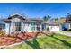 Well-maintained home exterior featuring manicured landscaping and a spacious two-car garage at 3115 Bent Creek Dr, Valrico, FL 33596