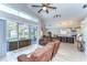 Open-concept living space with view of the screened pool and modern kitchen at 3115 Bent Creek Dr, Valrico, FL 33596