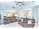 Bright and airy living room showcasing the open floor plan with kitchen and entry views at 3115 Bent Creek Dr, Valrico, FL 33596