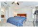 Relaxing main bedroom features neutral carpeting, a large window, and access to an en-suite bathroom at 3115 Bent Creek Dr, Valrico, FL 33596