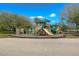Community playground with slides, climbing structures, and a soft landing surface for active play at 3115 Bent Creek Dr, Valrico, FL 33596
