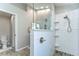 New shower features a subway tile wall, pebble floor, and glass divider panel, creating a modern design at 3115 Bent Creek Dr, Valrico, FL 33596