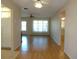 View of living room featuring wood flooring, a ceiling fan and open concept feel to the kitchen at 3472 100Th N Ter, Pinellas Park, FL 33782