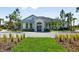 Exterior of community clubhouse with well manicured landscape at 3653 Forest Path Dr, Plant City, FL 33565