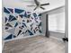 Bedroom with accent wall and a ceiling fan at 3654 Beneraid St, Land O Lakes, FL 34638