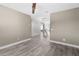 Neutral bedroom with grey hardwood flooring, ceiling fan at 3654 Beneraid St, Land O Lakes, FL 34638