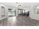 Open concept living room features kitchen, recessed lighting, and sliding glass doors leading to outdoor space at 3654 Beneraid St, Land O Lakes, FL 34638