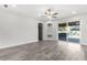 Bright living room features recessed lighting and sliding glass doors leading to outdoor living at 3654 Beneraid St, Land O Lakes, FL 34638