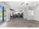 Spacious open floor plan connecting living room, dining area and kitchen, with views of pool at 3654 Beneraid St, Land O Lakes, FL 34638