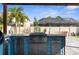 Outdoor kitchen features stainless steel grill and storage, complemented by a brick-paved patio and outdoor lights at 3654 Beneraid St, Land O Lakes, FL 34638