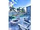 Inviting pool area with palm trees, a fire pit, and comfortable lounge seating at 3654 Beneraid St, Land O Lakes, FL 34638