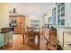 Dining room that offers hardwood floors and a chandelier with a view to the kitchen area at 36745 Kimela Ave, Zephyrhills, FL 33542