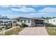 Charming single-story home with mature landscaping and a brick driveway at 36745 Kimela Ave, Zephyrhills, FL 33542