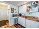 Bright kitchenette with microwave and sink next to door at 36745 Kimela Ave, Zephyrhills, FL 33542