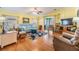 Inviting living room with hardwood floors, ceiling fan, and comfortable seating at 36745 Kimela Ave, Zephyrhills, FL 33542