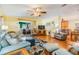 Bright and airy living room showcasing hardwood floors and comfortable furniture at 36745 Kimela Ave, Zephyrhills, FL 33542