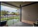 Balcony view of a serene canal with lush greenery and parking at 4112 Ashford Green Pl # I203, Tampa, FL 33613