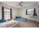 Bright bedroom with two large windows, ceiling fan and neutral carpet at 4112 Ashford Green Pl # I203, Tampa, FL 33613