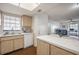 Kitchen view showcasing laminate countertops, sink, and view of living room at 4112 Ashford Green Pl # I203, Tampa, FL 33613