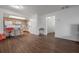Open floor plan with modern laminate flooring, connecting living and kitchen areas at 4112 Ashford Green Pl # I203, Tampa, FL 33613