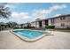 Community pool with lounge chairs, providing a relaxing outdoor space at 4112 Ashford Green Pl # I203, Tampa, FL 33613
