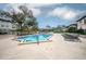 Inviting community pool area with ample seating and lush landscaping at 4112 Ashford Green Pl # I203, Tampa, FL 33613