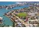 Aerial view of the home with a waterway and businesses, and neighborhood around the property at 479 80Th Way, St Pete Beach, FL 33706