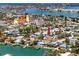 Aerial view of the home with the beautiful waterways, church, businesses, and neighborhood around the property at 479 80Th Way, St Pete Beach, FL 33706