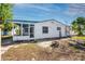 Backyard view of the home highlighting the patio, siding, and spacious area at 479 80Th Way, St Pete Beach, FL 33706