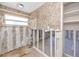 Bathroom with a window and textured wallpaper awaiting renovation at 479 80Th Way, St Pete Beach, FL 33706