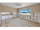 Bedroom features a ceiling fan, large windows, and neutral wall color at 479 80Th Way, St Pete Beach, FL 33706