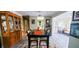 Elegant dining room with a long table, decorative rug, and a view into the adjacent living spaces, ideal for gatherings at 479 80Th Way, St Pete Beach, FL 33706