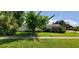 This lovely single-story home offers a lush green lawn, mature trees, and classic charm at 479 80Th Way, St Pete Beach, FL 33706