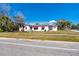 Street view of a charming residential property featuring classic architecture and a well-kept lawn at 479 80Th Way, St Pete Beach, FL 33706