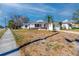 Inviting single-story home with a red front door, curb appeal, and a prime location at 479 80Th Way, St Pete Beach, FL 33706