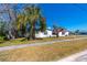 Attractive single-story home with red awnings, mature landscaping, and a corner lot location at 479 80Th Way, St Pete Beach, FL 33706