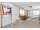 Functional garage featuring a work table, garage door, and an American flag at 479 80Th Way, St Pete Beach, FL 33706