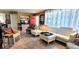 Well-lit living room with a comfortable sofa, stylish accents, and an inviting atmosphere for relaxation and entertainment at 479 80Th Way, St Pete Beach, FL 33706