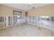 Spacious, open layout of living room features neutral paint and large windows at 479 80Th Way, St Pete Beach, FL 33706