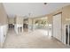 Open floor plan with adjoining kitchen area and large windows throughout at 479 80Th Way, St Pete Beach, FL 33706