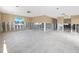 Spacious living room featuring a large open floor plan and terrazzo flooring at 479 80Th Way, St Pete Beach, FL 33706