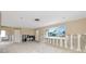 Open floor plan living room with large windows providing natural light at 479 80Th Way, St Pete Beach, FL 33706
