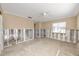 Large living room with two windows and exposed framework in need of renovations at 479 80Th Way, St Pete Beach, FL 33706